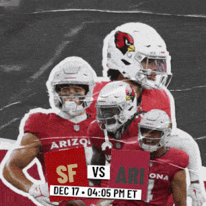 a group of arizona football players holding up a sign that says sf vs ari