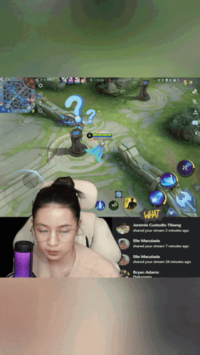 a woman playing a video game with the words what on the bottom right