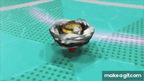 two spinning tops are fighting each other on a green surface .