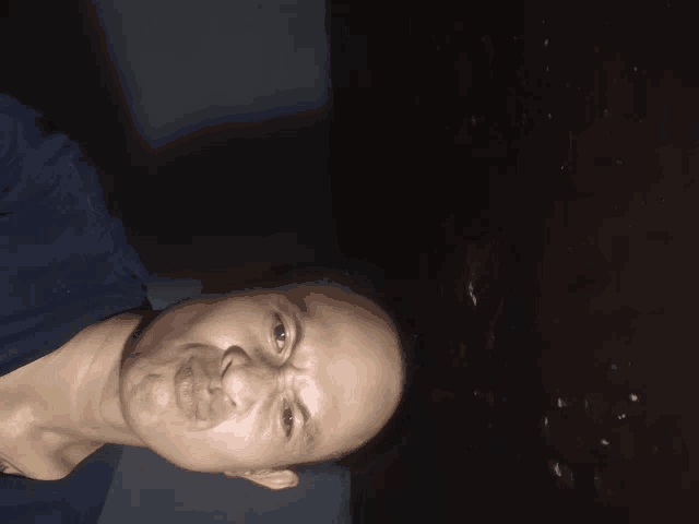 a close up of a man 's face with his eyes closed