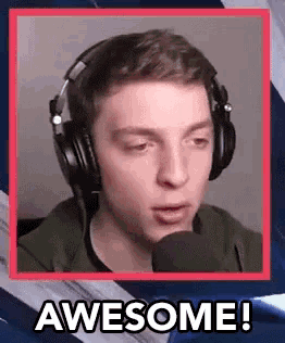 a young man wearing headphones is talking into a microphone and saying `` awesome '' .
