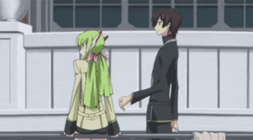 a man and a woman are standing next to each other on a balcony .