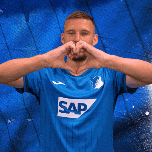 a man wearing a blue shirt with the word sap on the front