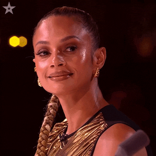 a close up of a woman 's face with a star in the upper right corner