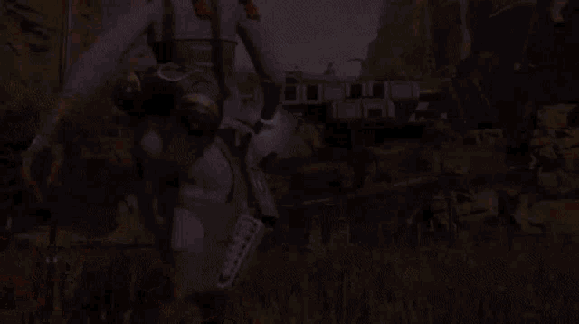 a person in a futuristic suit is standing in a field