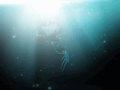 a person is holding another person 's hand underwater