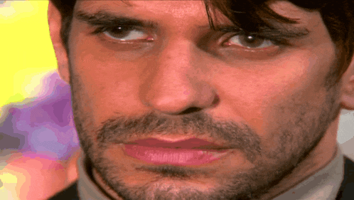 a man with a beard and lipstick on his lips