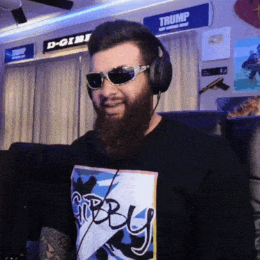 a man wearing sunglasses and a gibby shirt