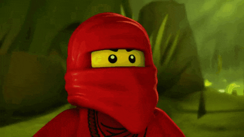 a lego ninjago character is covering his face with a red cloth