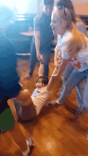 a group of people are playing a game and one of them is wearing a shirt that says ' snoopy ' on it