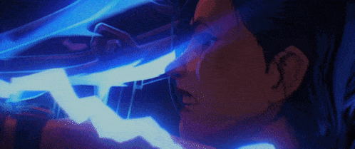 a close up of a person 's face with a blue light coming out of it