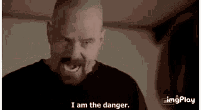 a man with a beard is screaming and says i am the danger