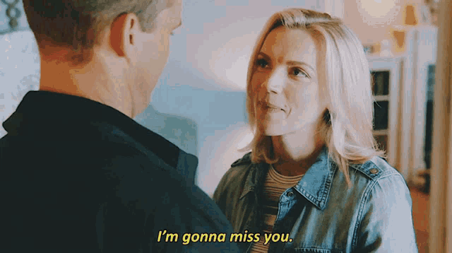 a man and a woman are looking at each other and the woman is saying i 'm gonna miss you