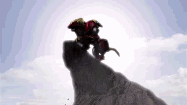 a robot is riding on the back of a horse on top of a cliff