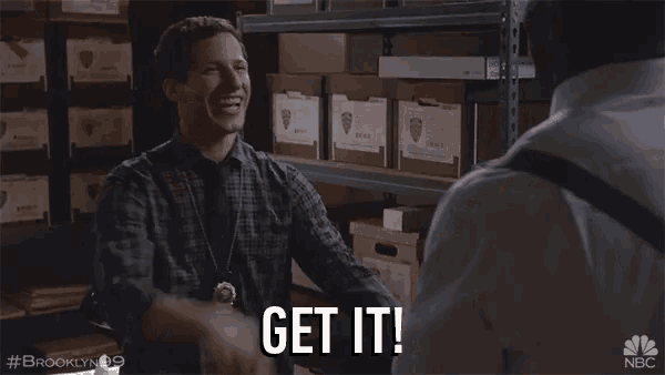 a man in a plaid shirt says get it in a warehouse