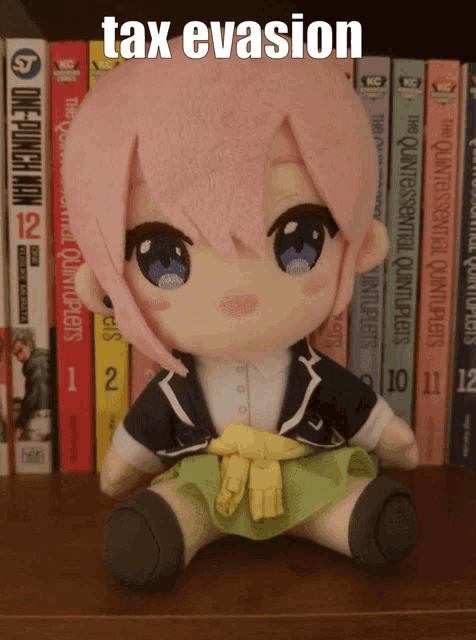 a stuffed doll sits in front of a shelf of books including one punch man and the quintessential quintuplets