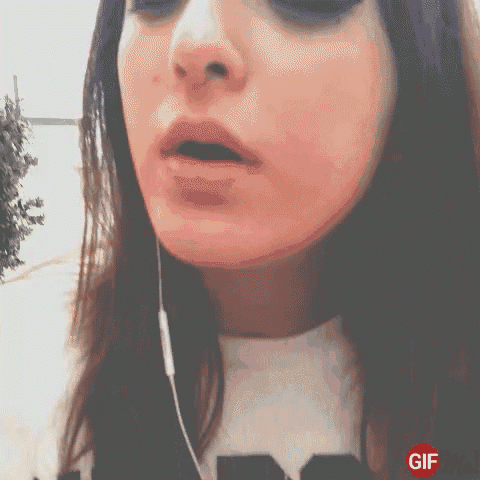 a close up of a woman 's face with a gif on the bottom left