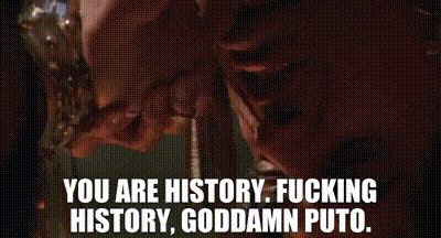 a close up of a person 's face and the words `` you are history , fucking history , goddamn puto '' .