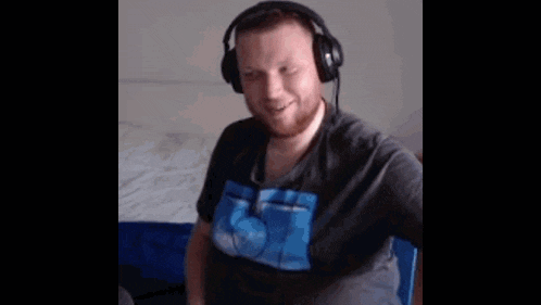 a man wearing headphones and a shirt that says 5