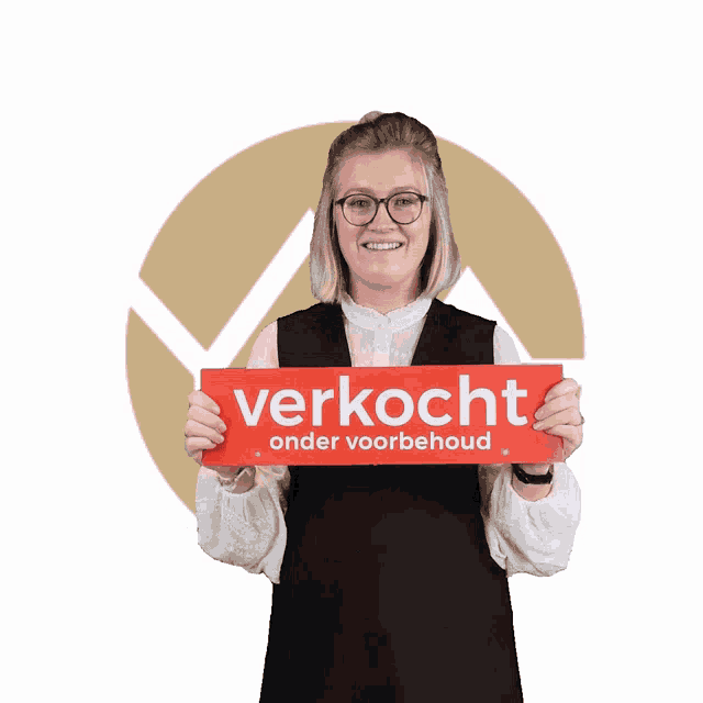 a woman holds up a red sign that says verkocht onder voorbehoud