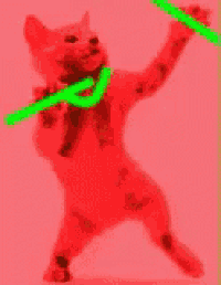 a blue cat wearing a green necklace is standing on its hind legs