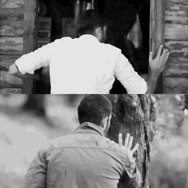 a black and white photo of a man standing in front of a wooden door