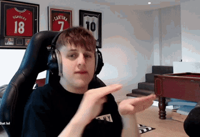 a man wearing headphones and a shirt with the number 18