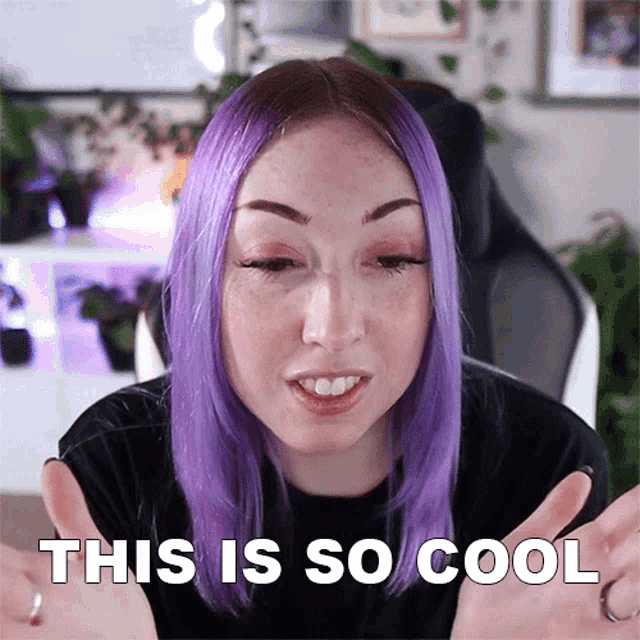 a woman with purple hair and freckles says " this is so cool "
