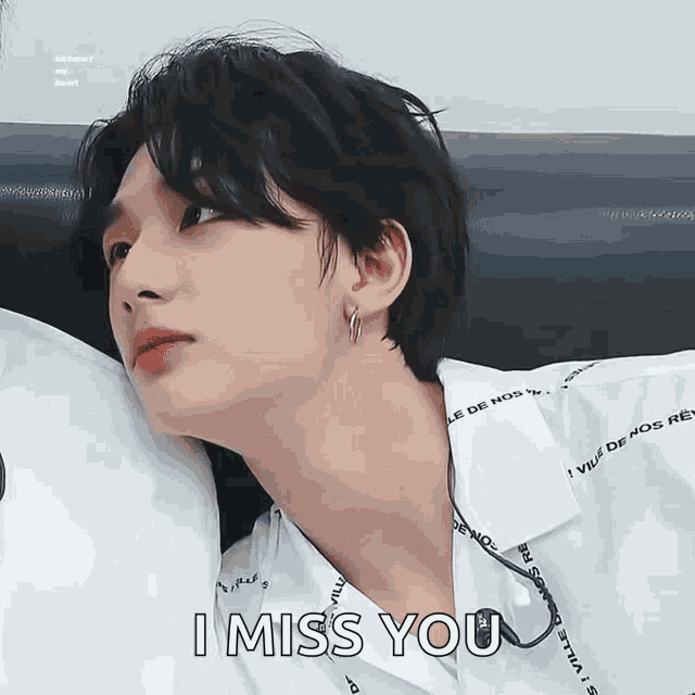 a close up of a person 's face with the words i miss you written on the bottom