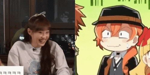 a woman is smiling next to a cartoon character with a hat