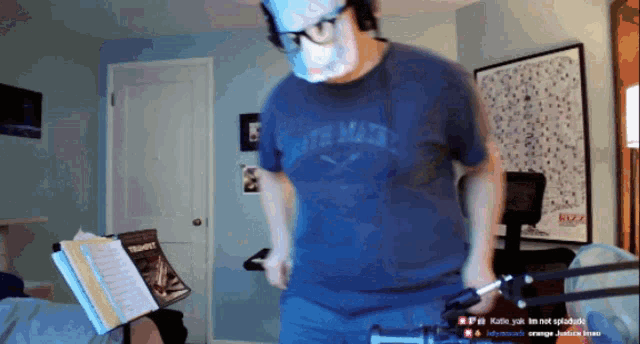 a man wearing a mask and a shirt that says ' south main '