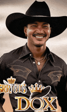a man wearing a cowboy hat and a shirt that says ' dox ' on it