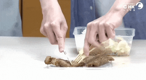a person is cutting a piece of meat with a fork in front of a container that says channel 9 live