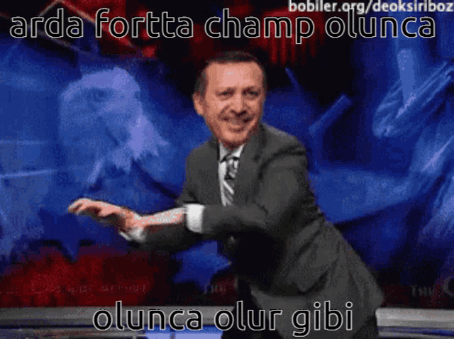 a man in a suit and tie is dancing in front of a screen that says arda fortta champ olunca