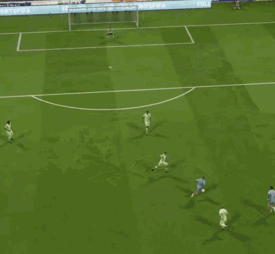 a group of soccer players are playing on a field and one player has the number 23 on his jersey