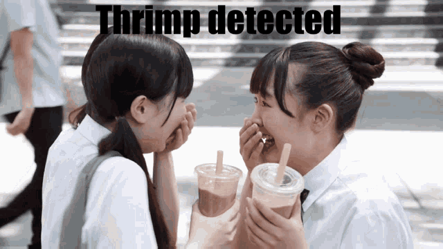 two girls are laughing with the words thrump detected behind them