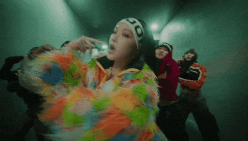 a woman wearing a headband with the number 30 on it is dancing
