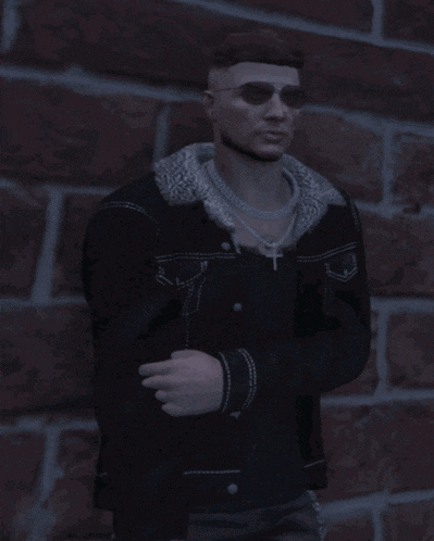 a man wearing sunglasses and a black jacket is standing in front of a red brick wall