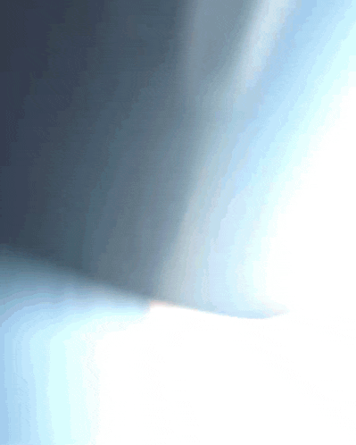 a blue and white background with a light coming out of it