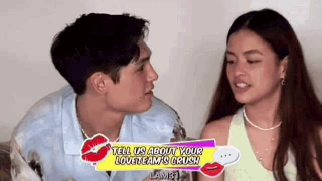 a man and a woman are looking at each other and the man is kissing the woman on the forehead .