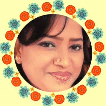 a close up of a woman 's face in a circle of flowers