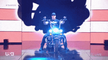 a man is riding a motorcycle in front of a usa live logo