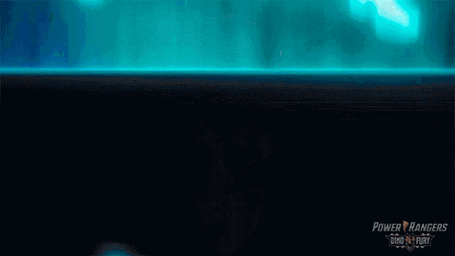 a power rangers poster with a blue light coming out of a person 's foot