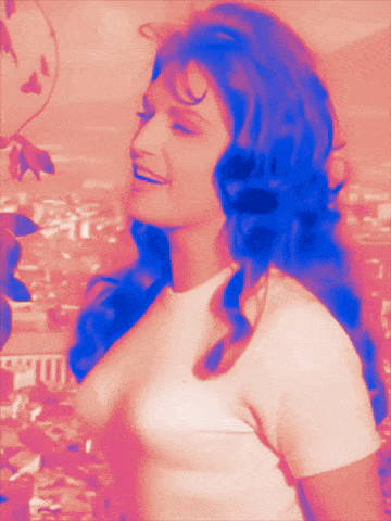 a woman with long blue hair and a white shirt