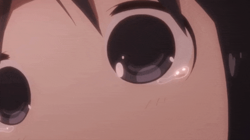 a close up of a person 's eyes with tears running down them