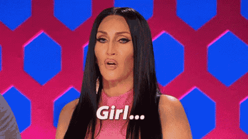 a woman with long black hair is sitting in front of a pink and blue background .