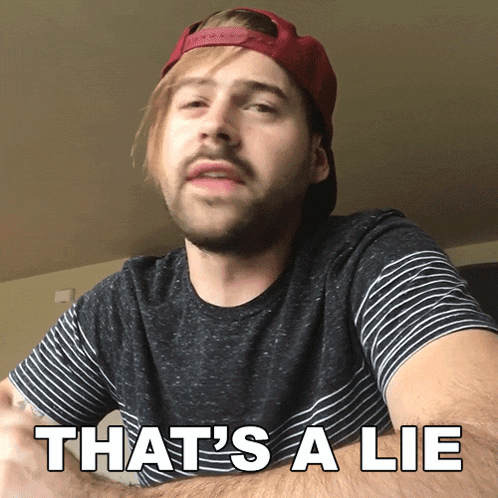 a man wearing a hat says that 's a lie on his shirt