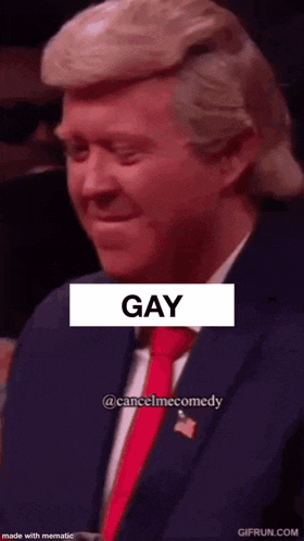 a close up of a man in a suit and tie with the word gay written on it .