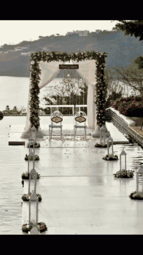 a wedding aisle with a sign that says " welcome to the wedding "