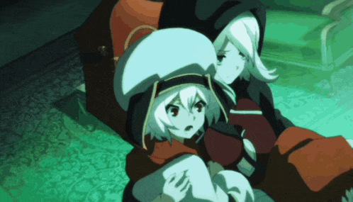 a couple of anime characters sitting next to each other on a green rug